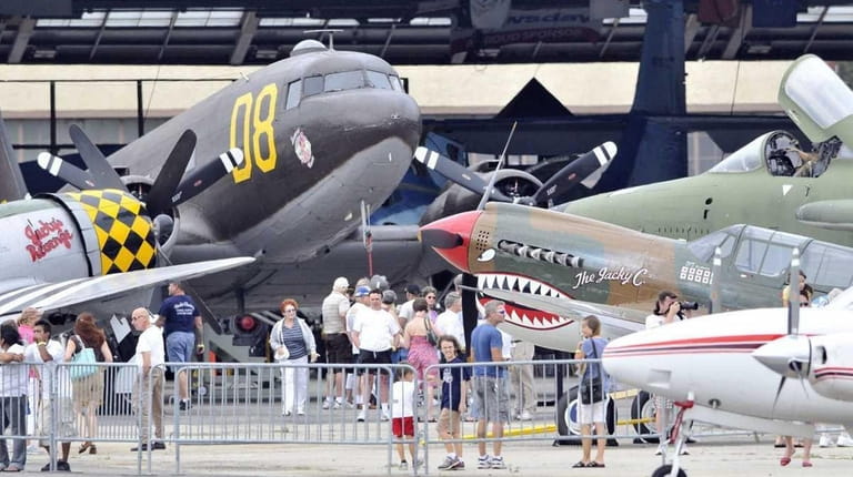 Aviation enthuiasts toured the old warbirds at the American Air...