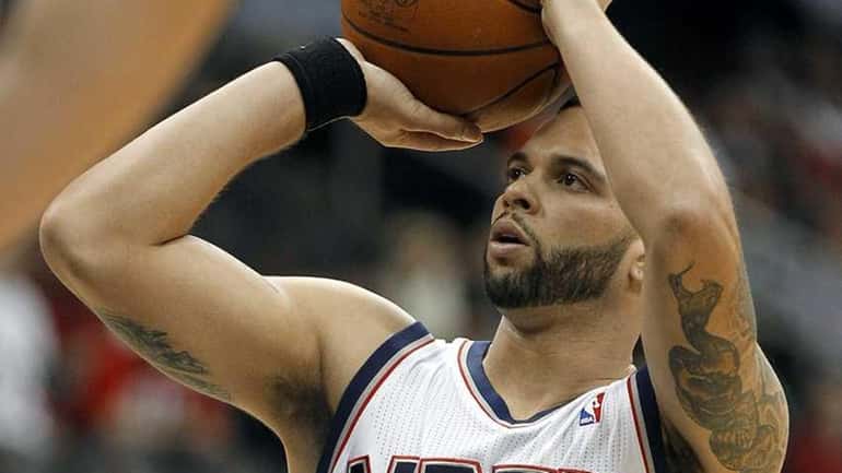 Nets point guard Deron Williams makes a free throw during...