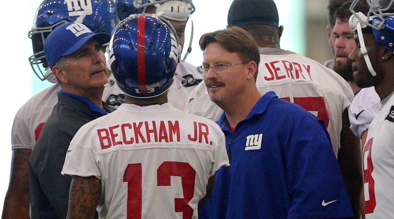 New York Giants head coach Ben McAdoo talks with New...