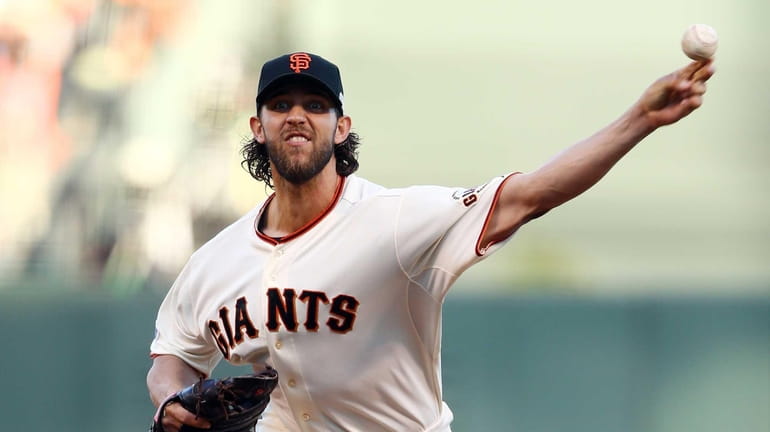 San Francisco Giants pitcher Madison Bumgarner throws during the first...