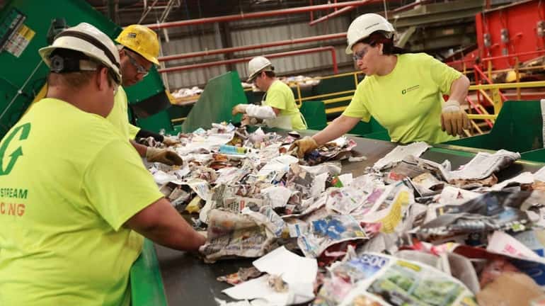 Workers at the Town of Brookhaven recycling center in Yaphank.