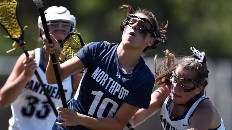 Northport's Olivia Carner, left, is defended by Pittsford's Abby Hopfinger...
