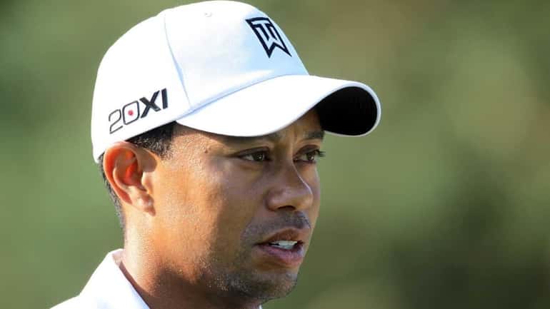 Tiger Woods walks off of the tee box on the...