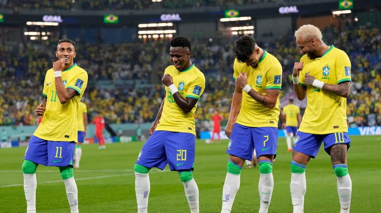 Brazil's Vinicius Junior, 2nd left, celebrates after scoring his side's...
