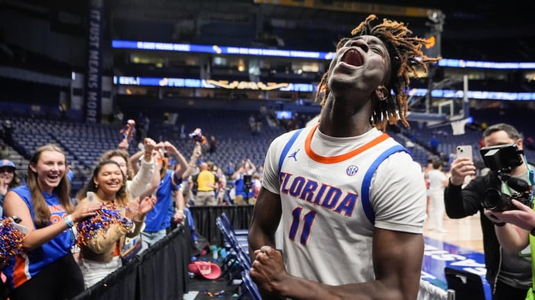 Florida guard Denzel Aberdeen reacts as he leaves the court...