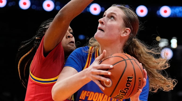 Kate Koval (13) is fouled by West forward Mackenly Randolph,...