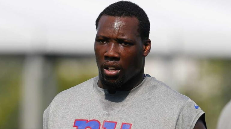 Jason Pierre-Paul of the Giants looks on during conditioning drills...