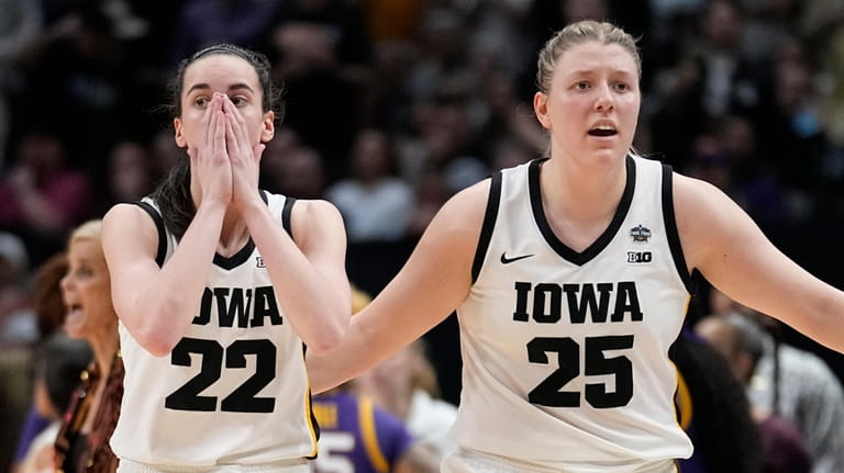 FILE -Iowa's Caitlin Clark and Monika Czinano react during an...