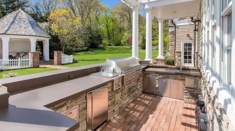 The house has an outdoor kitchen.