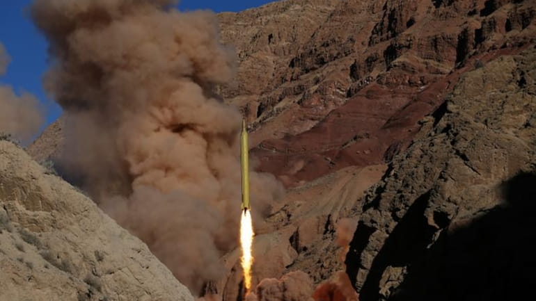 A Qadr H long-range ballistic surface-to-surface missile is fired by...
