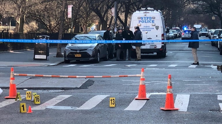 NYPD detectives on Thursday investigate the fatal shootings near Tompkins Square Park.