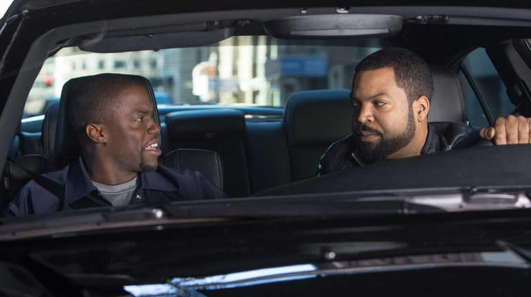 Ice Cube, right, and Kevin Hart in a scene from...