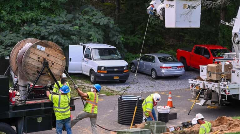 Hawkeye Electric crews work on restoring power to residents at...