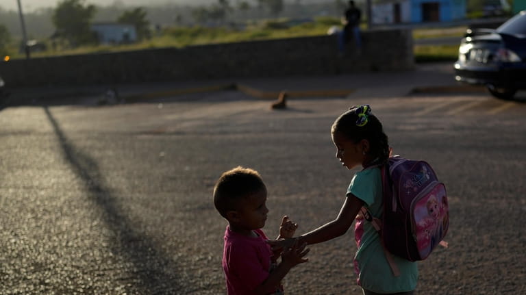 The children of Venezuelan migrants Miguel Gonzalez and Maryelis Rodriguez...