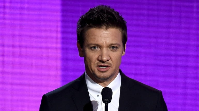 Actor Jeremy Renner presents an award during the 2015 AMAs...