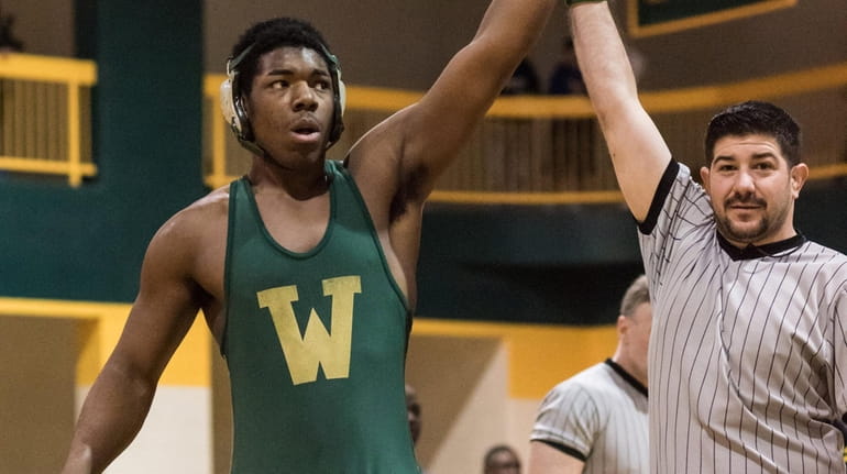 Westbury's Jeremiah Funchess wins the 220-pound semifinal against Uniondale's Adonis...