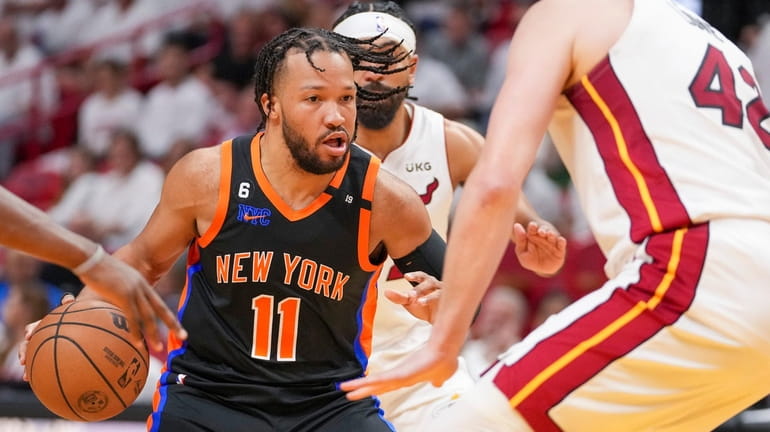 Jalen Brunson of the Knicks looks for a way to the basket...