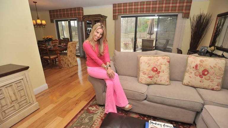 Gail Siegel shows the in the living room of her...