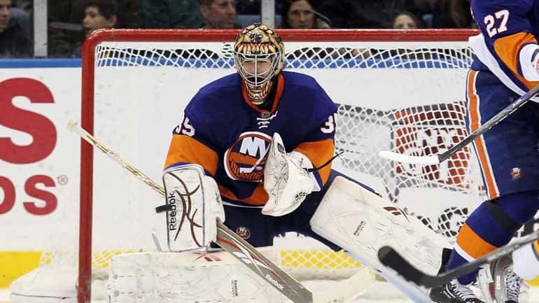The Islanders' Al Montoya makes a third-period save against the...