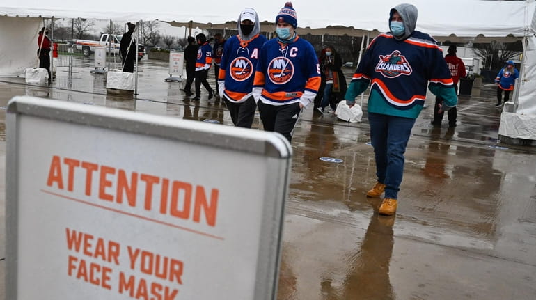 Islanders fans arrive at the screening area in front of...