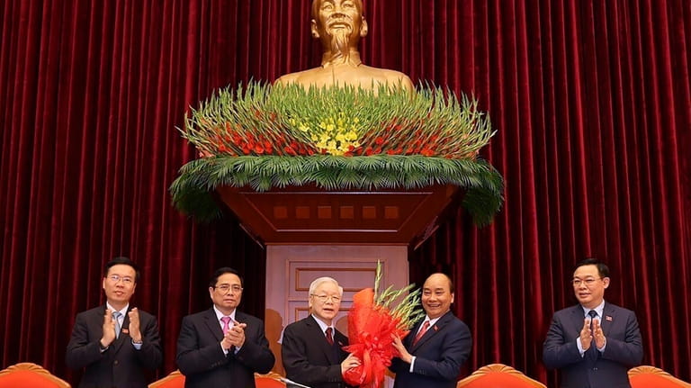 Vietnam Communist party General Secretary Nguyen Phu Trong, center left,...