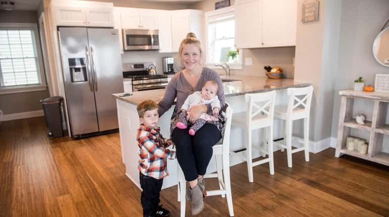 Kate Reilly with her children, Brendan and Emma, at home...