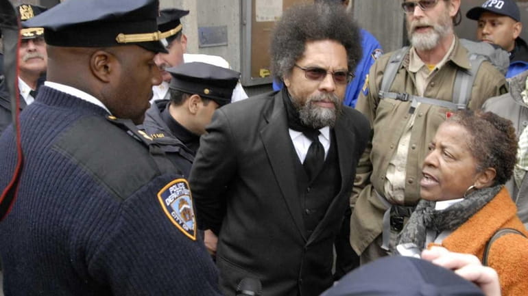 Political activist Dr. Cornel West is taken into custody by...