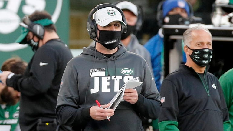 Head coach Adam Gase of the Jets looks on during...
