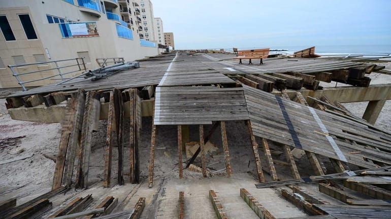 The Long Beach boardwalk remained heavily damaged 2 1/2 months...