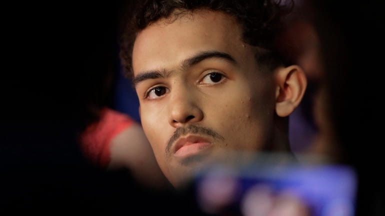 Trae Young from Oklahoma listens to a question during the...