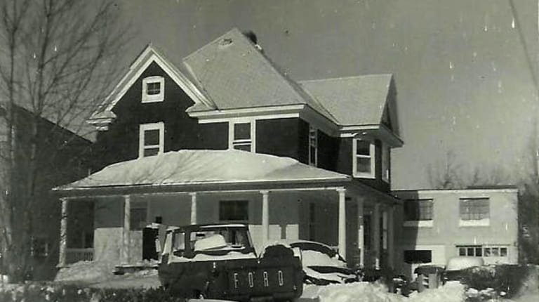 A February 1964 snowstorm covers the Merklin family house at...