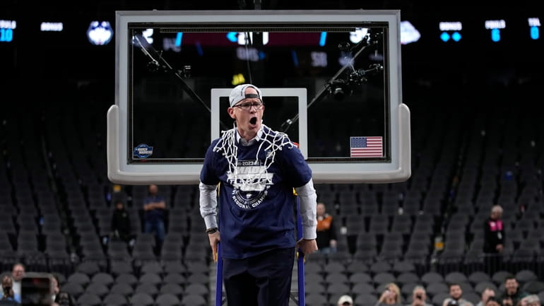 UConn head coach Dan Hurley celebrates after cutting down the...