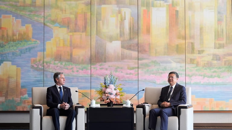 U.S. Secretary of State Antony Blinken, left, talks with Shanghai...