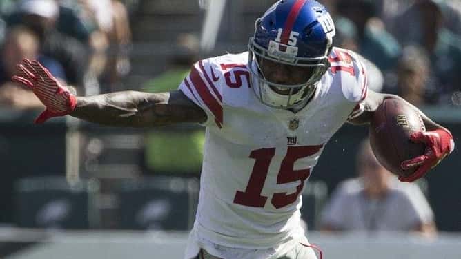 Brandon Marshall of the Giants runs with the ball against...
