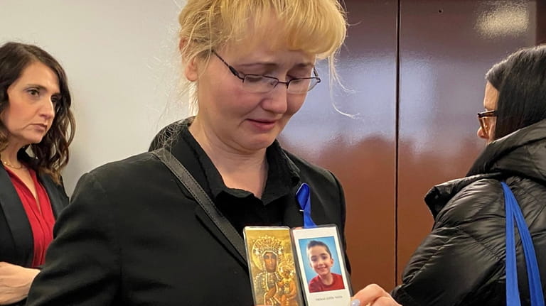 Justyna Zubko-Valva with a photo of her son Thomas Valva...