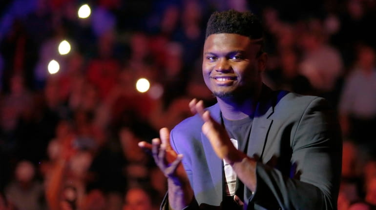 Pelicans forward Zion Williamson (1) applauds as the Pelicans are...