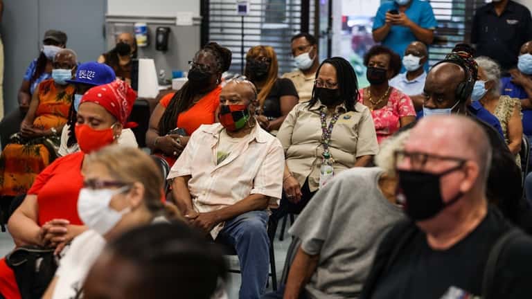Gordon Heights residents listen as Heastie talked about climate change,...