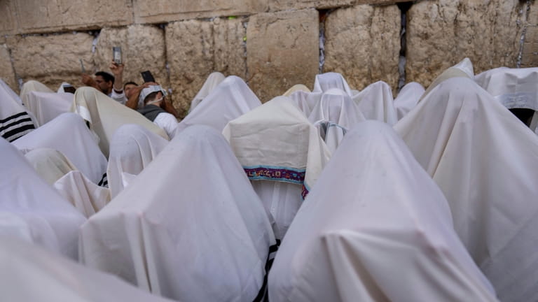 Israeli ultra-Orthodox worshippers pray during the Jewish holiday of Sukkot...