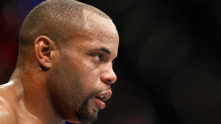 Daniel Cormier waits in a time-out as he takes on...