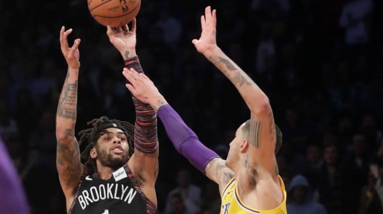 The Nets' D'Angelo Russell shoots over the Lakers' Kyle Kuzma during the...