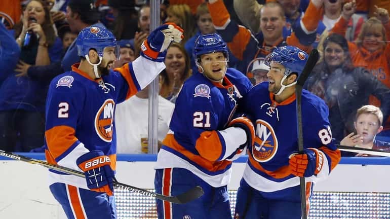 Cory Conacher of the Islanders celebrates his first-period goal against...