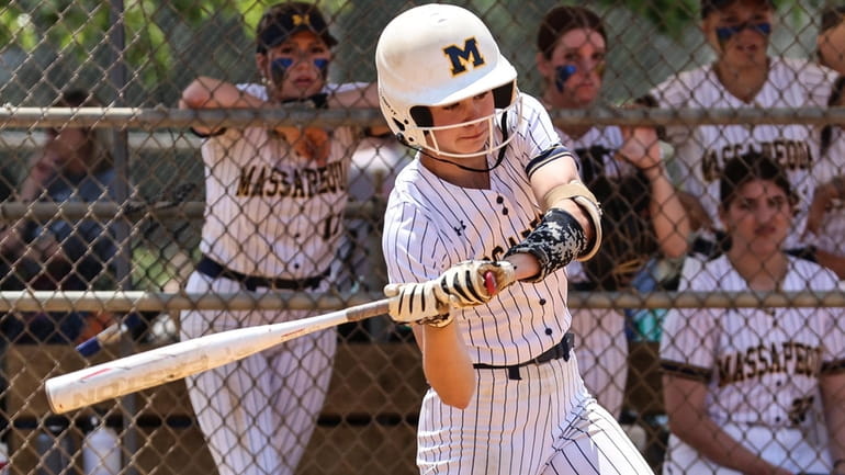 Lauren O'Brien of Massapequa takes a swing during game 2...