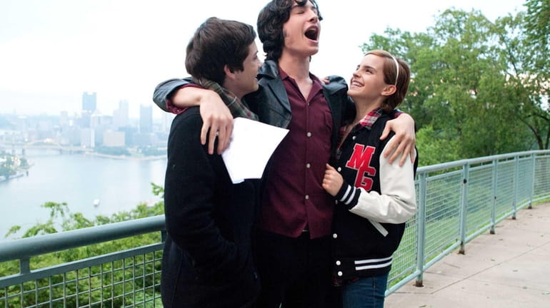 Logan Lerman (from left), Ezra Miller and Emma Watson in...