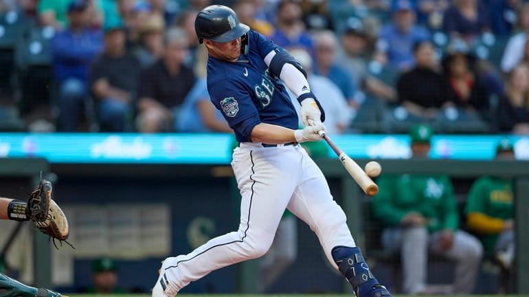 Seattle Mariners' Ty France hits a solo home run on...