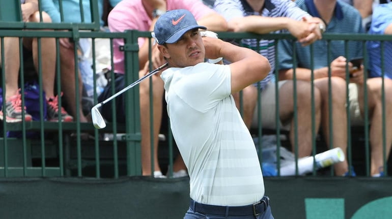 Brooks Koepka plays a shot on the 10th hole during...