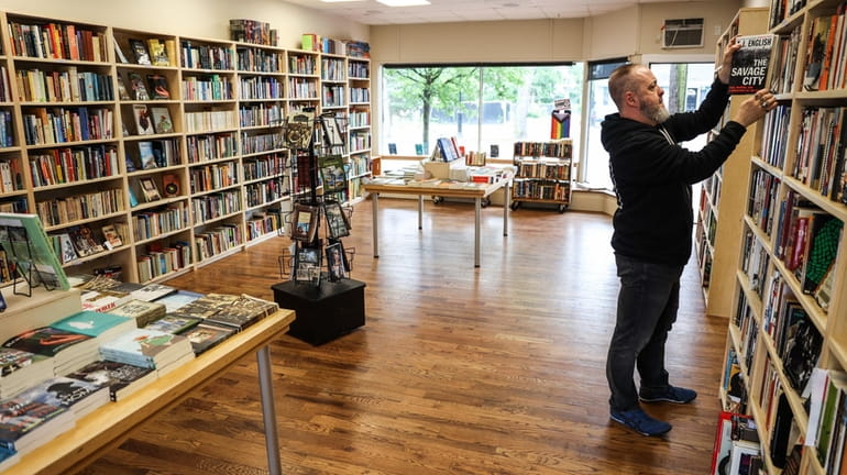 Daniel McGowan opened Tiny Raccoon Books in downtown Sayville in April with...