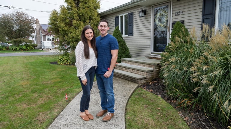 Nicole and Cory Fraile, outside their West Babylon home, are looking...