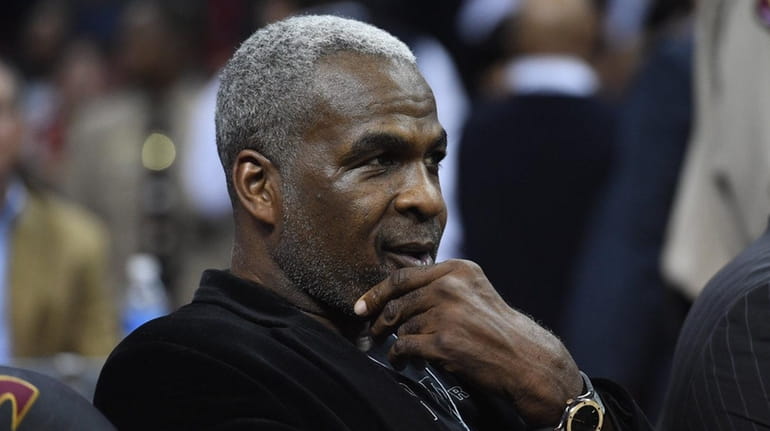 Former NBA player Charles Oakley sits courtside prior to the...