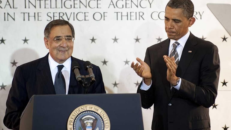 US President Barack Obama applauds CIA Director Leon Panetta at...