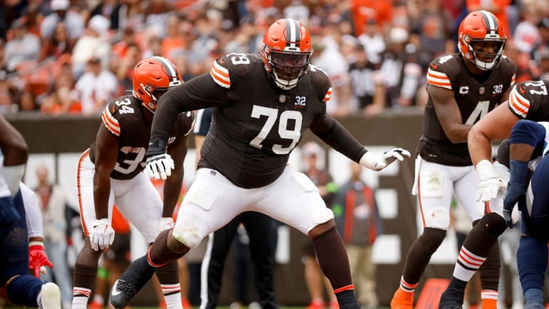 FILE -Cleveland Browns offensive tackle Dawand Jones (79) looks to...